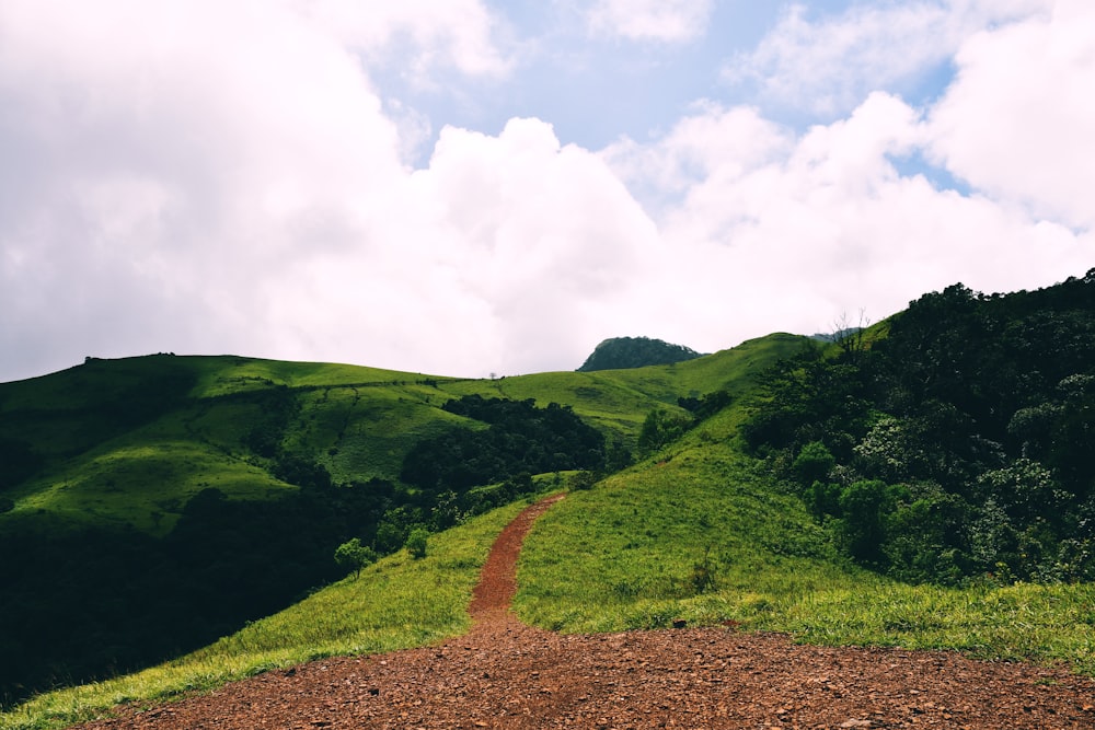 a dirt road going up a hill