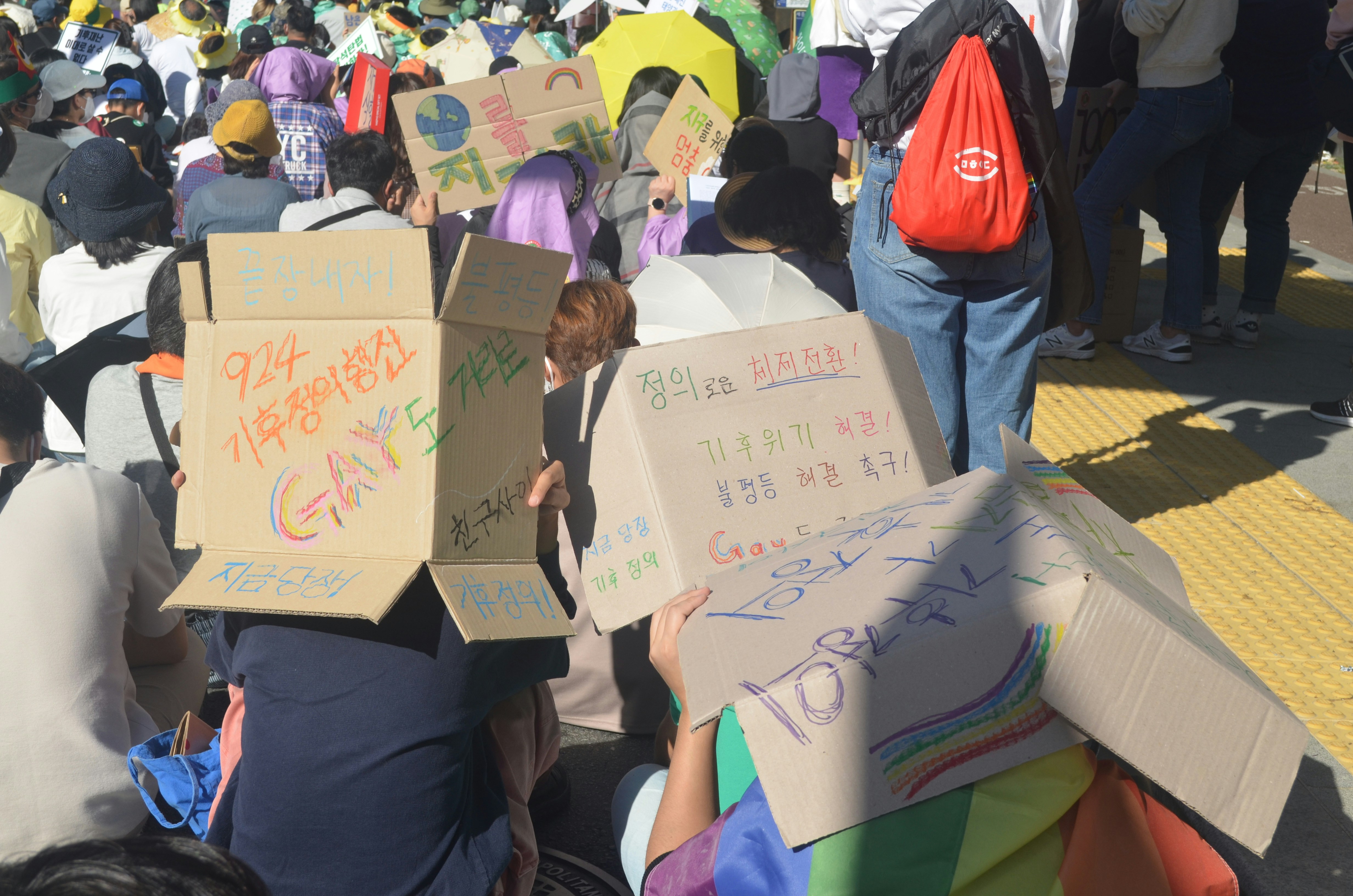 Climate activists holding signs at an international conference