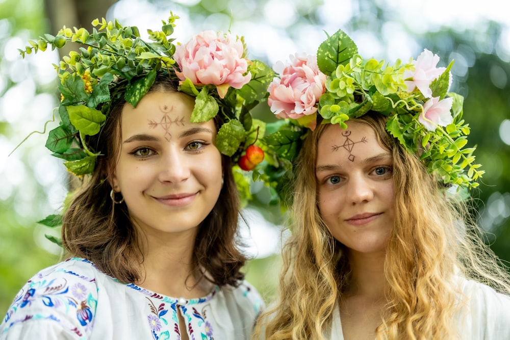 two girls with flowers on their heads