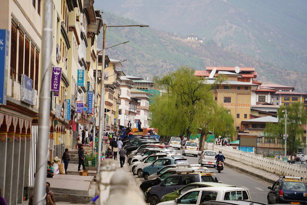 a busy street with cars and people