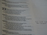 A page of text featuring biblical proverbs with sayings numbered prominently on the left side. The text discusses dining with rulers, avoiding gluttony, and the deceitfulness of riches. Handwritten notes are visible in the margins on the right.