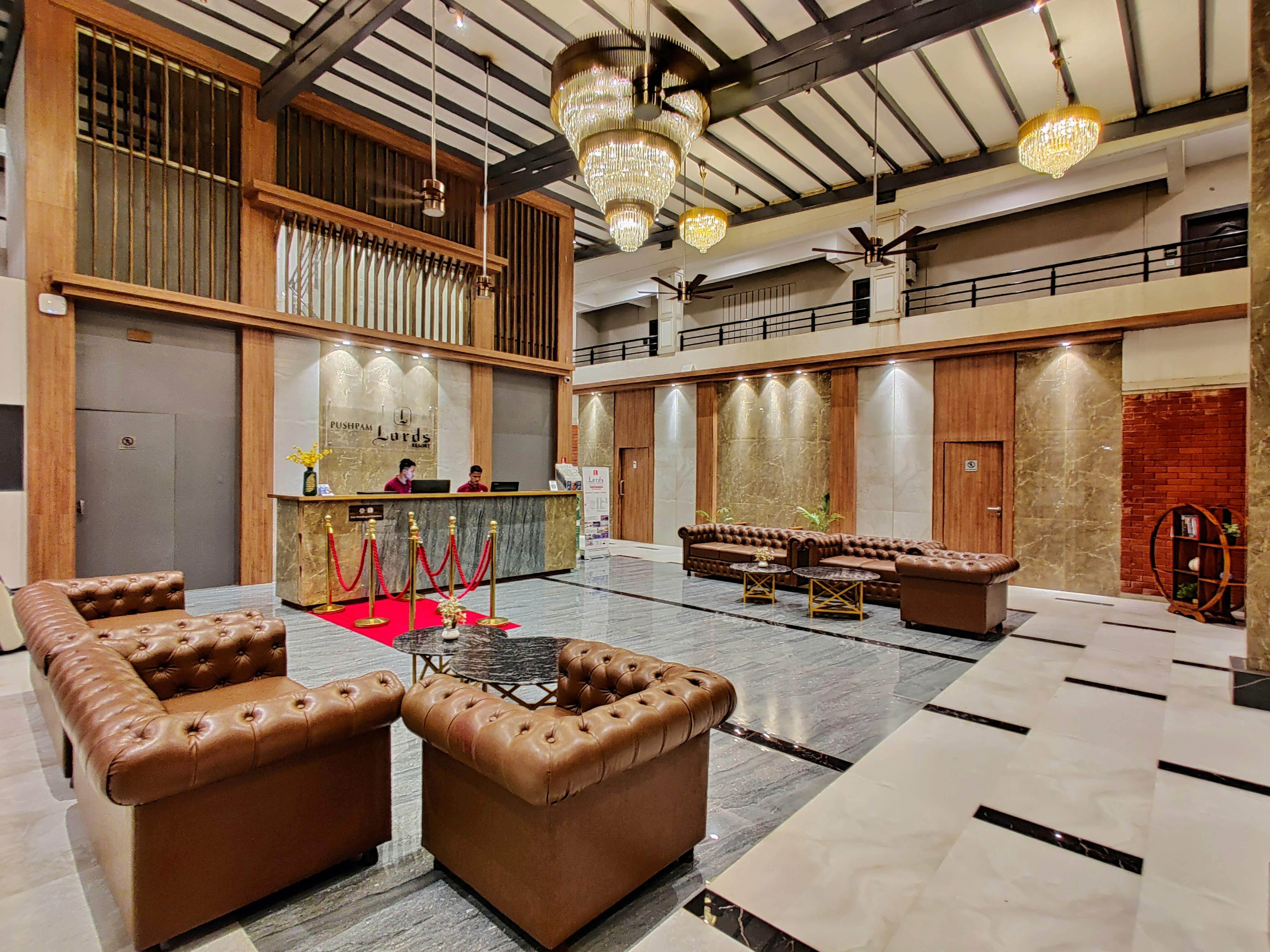 Luxury hotel reception area with professional hospitality staff