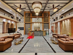 a large room with a large chandelier and a large glass door