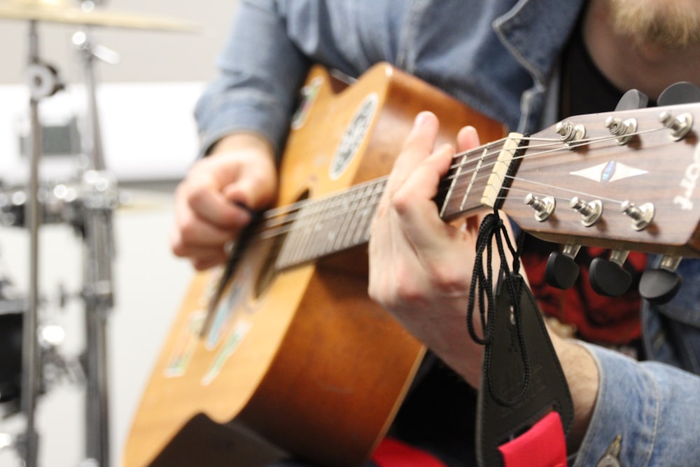 a person playing a guitar