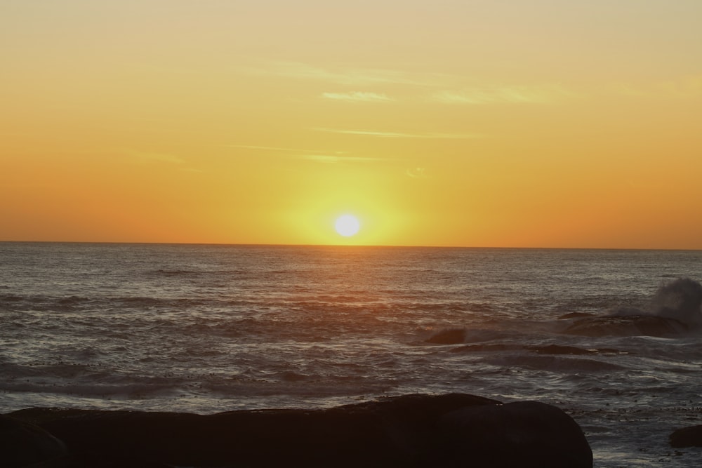 a sunset over the ocean