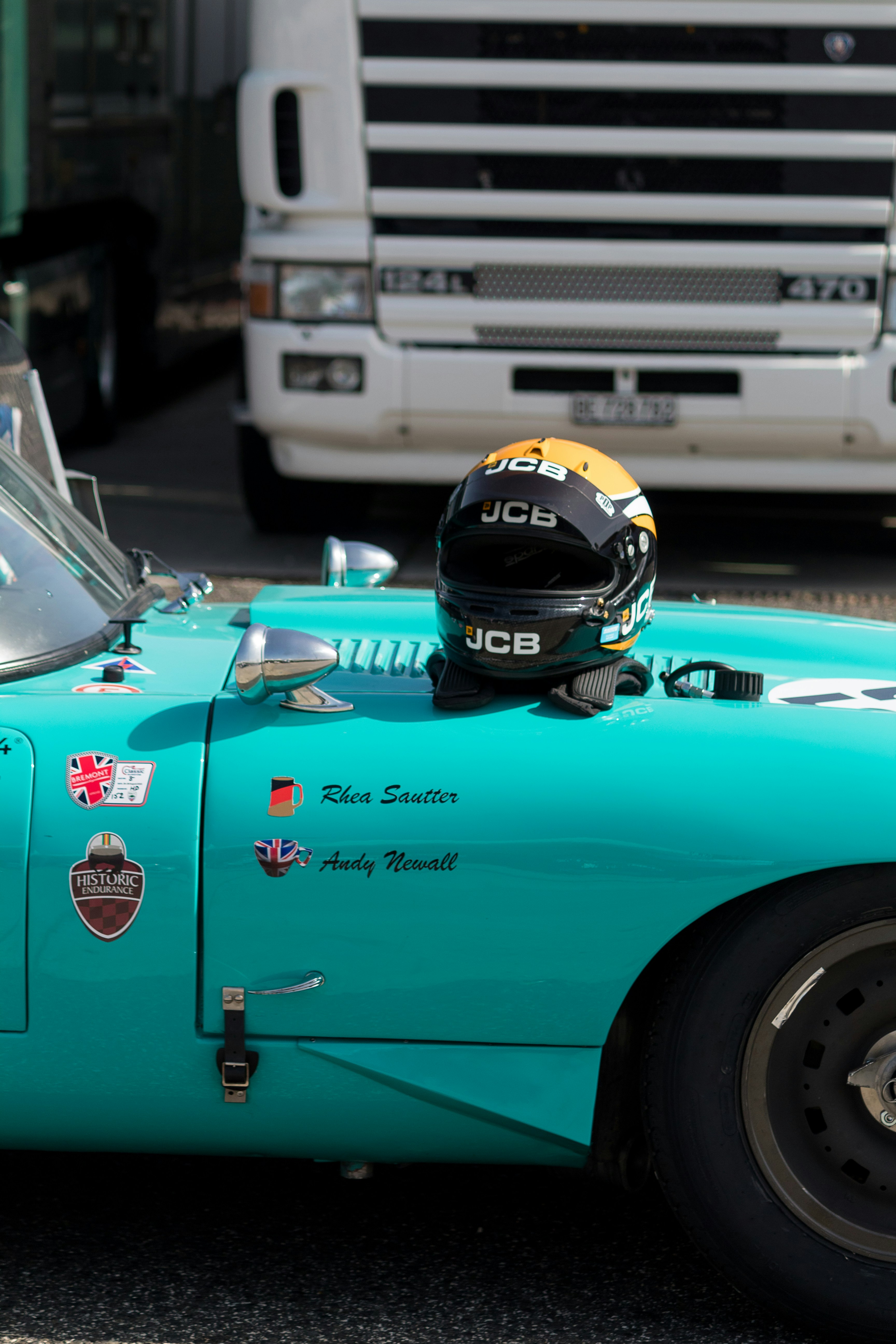 Racing helmet resting on the bonnet.