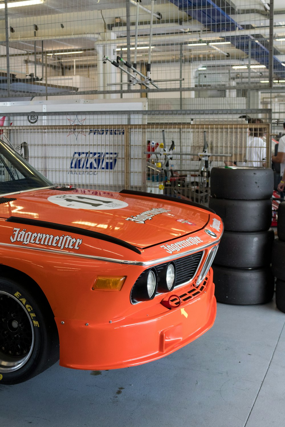 a race car parked in a garage