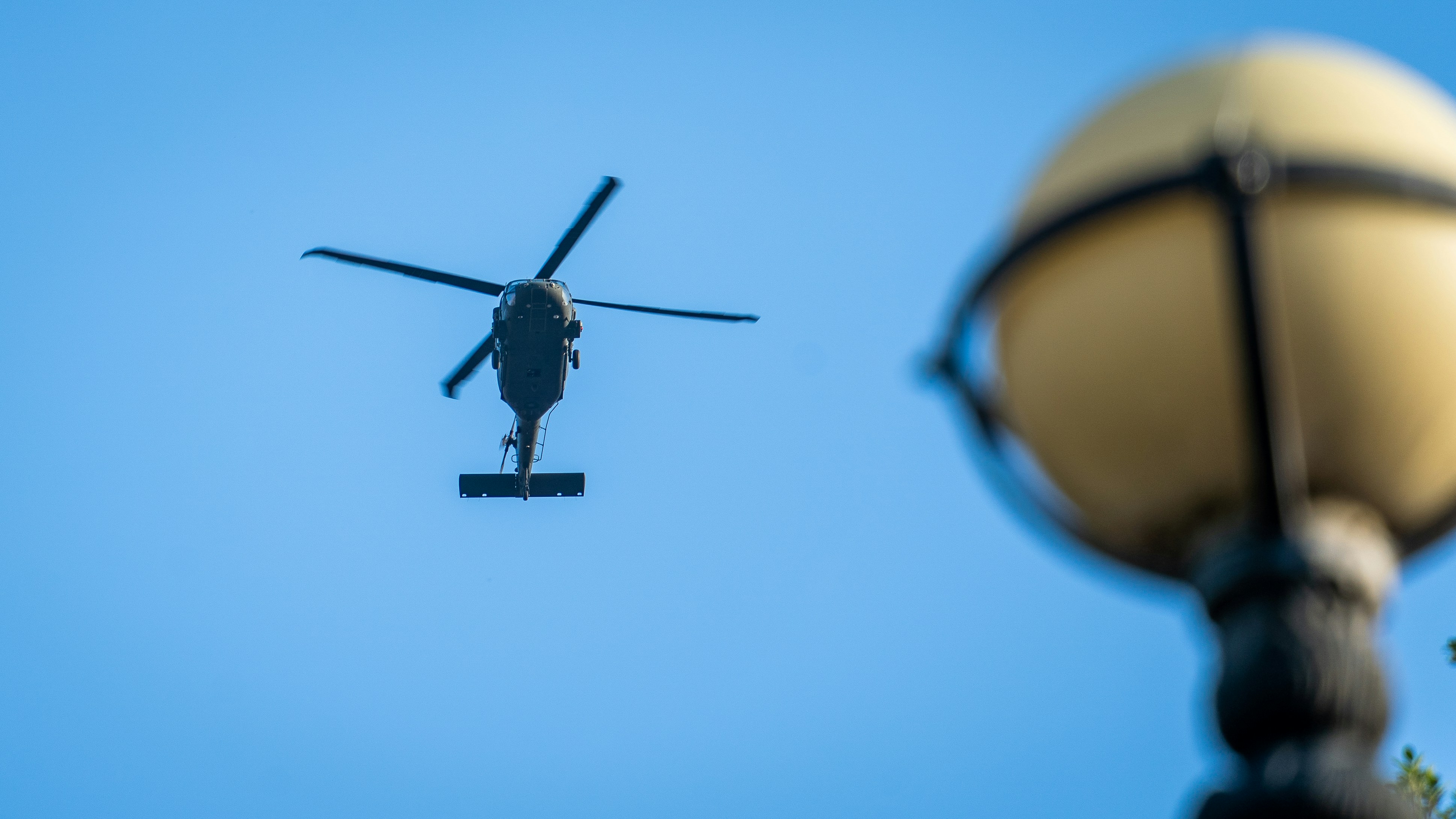 a helicopter flying in the sky, 