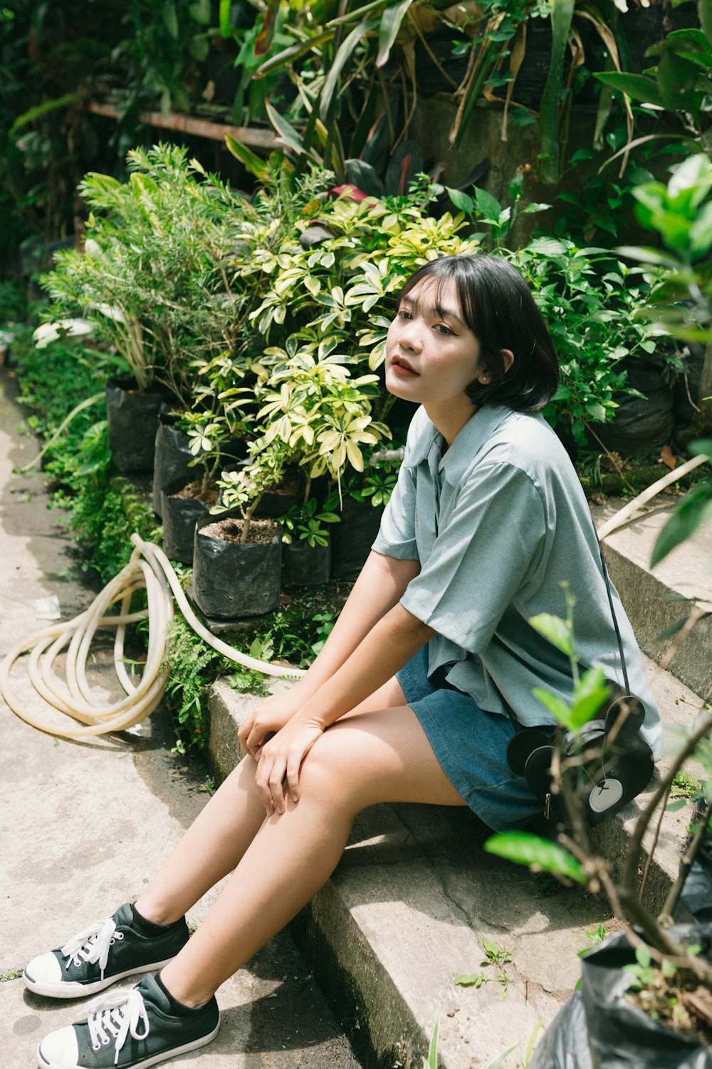 a person sitting on a stone ledge