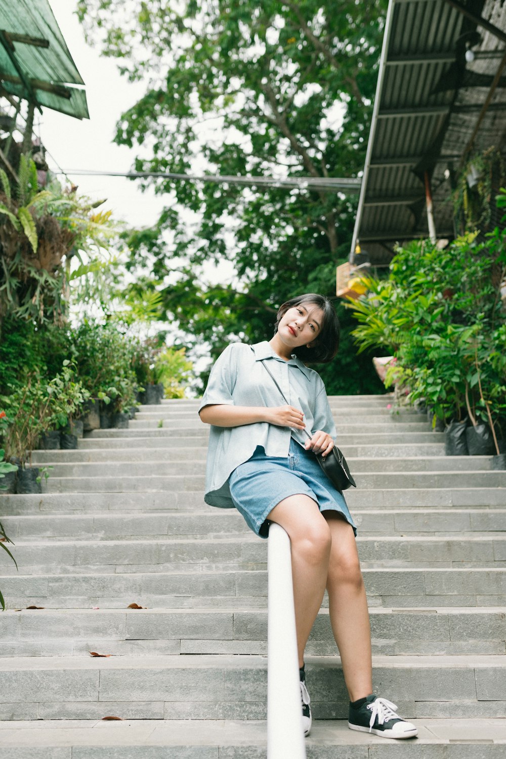 a woman sitting on stairs