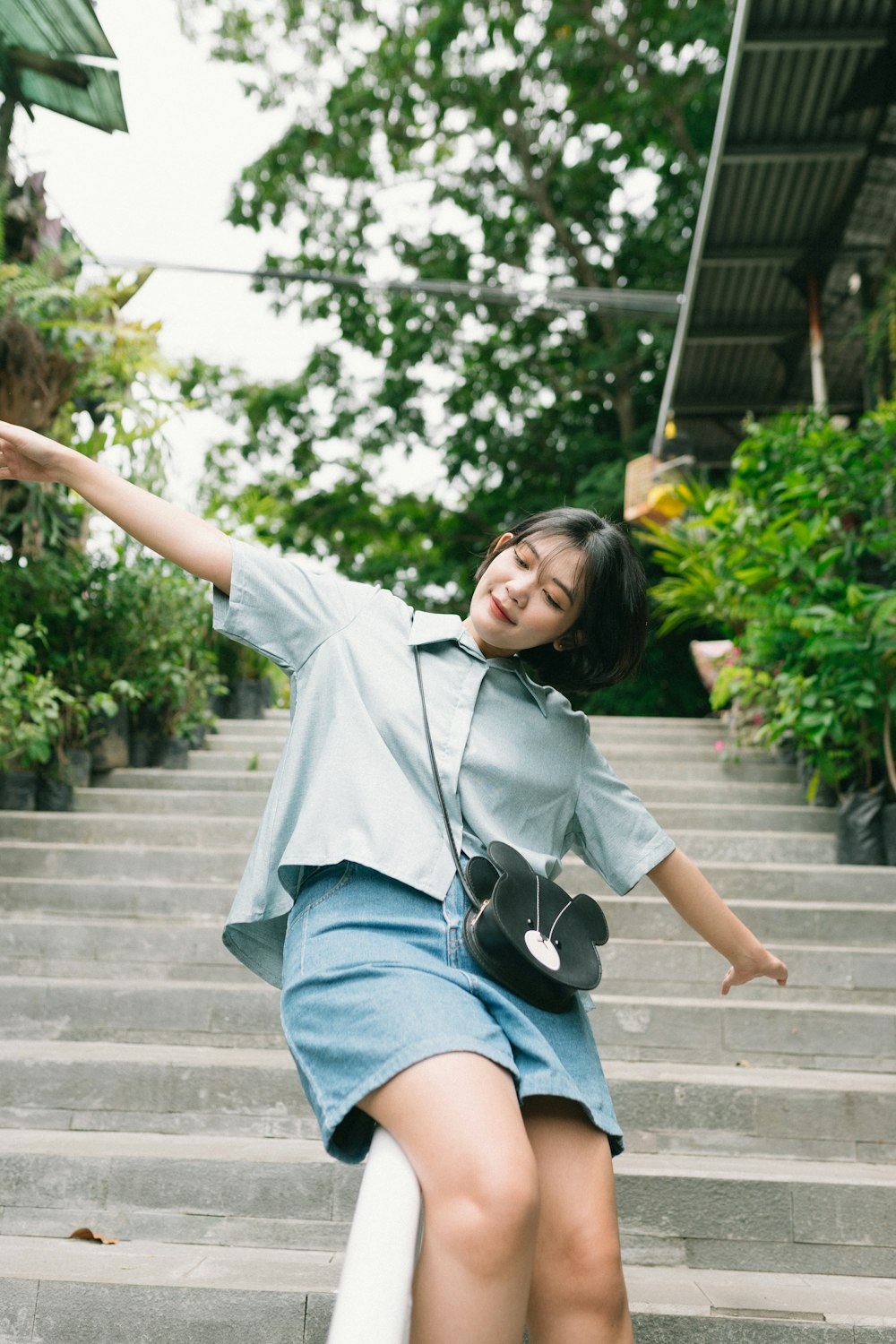 a person posing on stairs