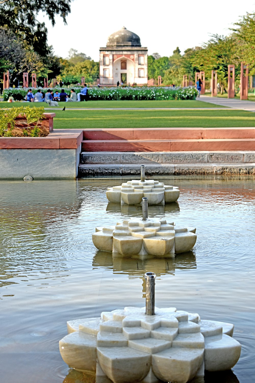 a fountain in a pond