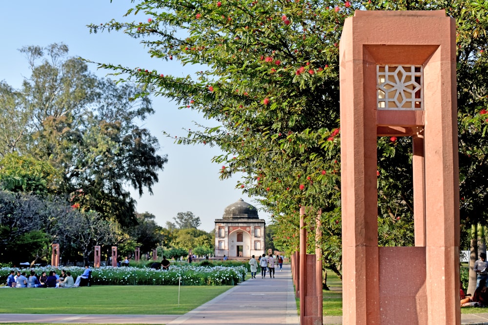 a walkway with a building and trees