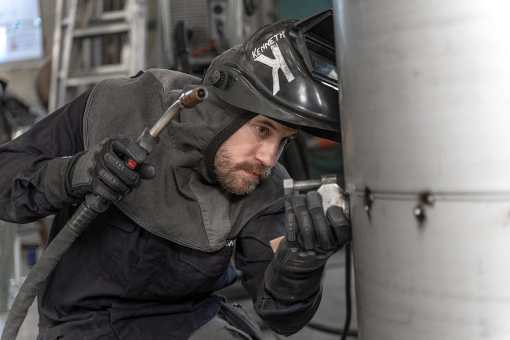 a man wearing a helmet and holding a gun