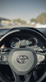 Close-up of a Toyota car dashboard showing modern features and controls.