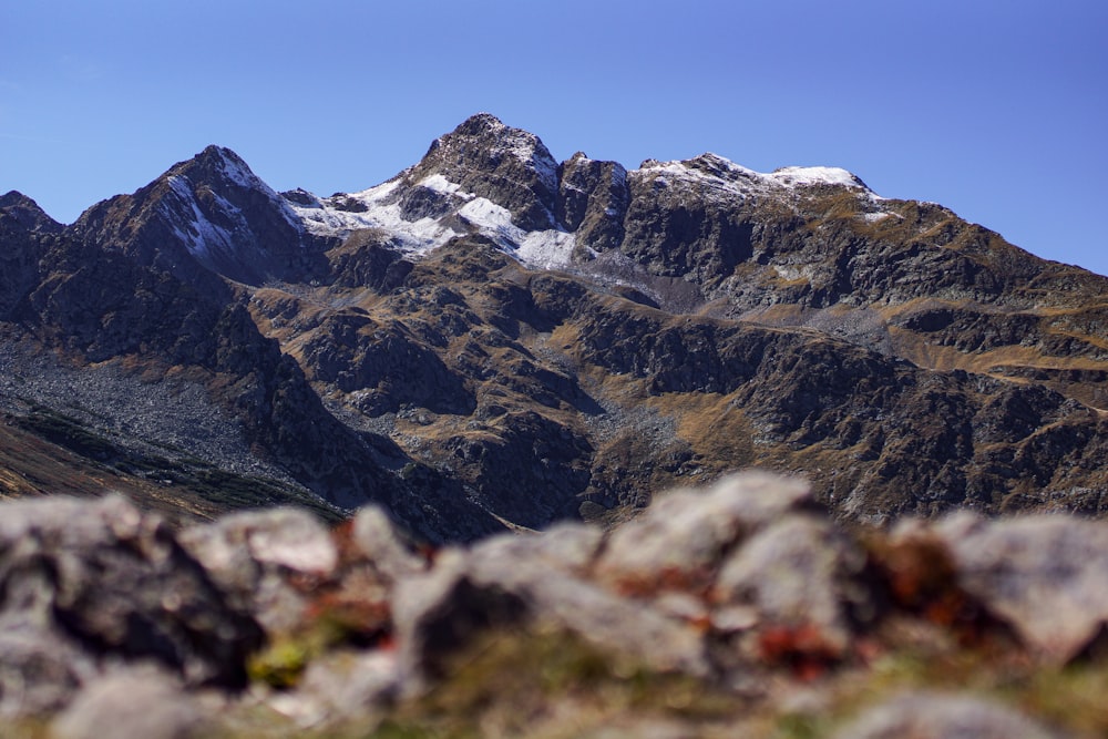 a rocky mountain with snow