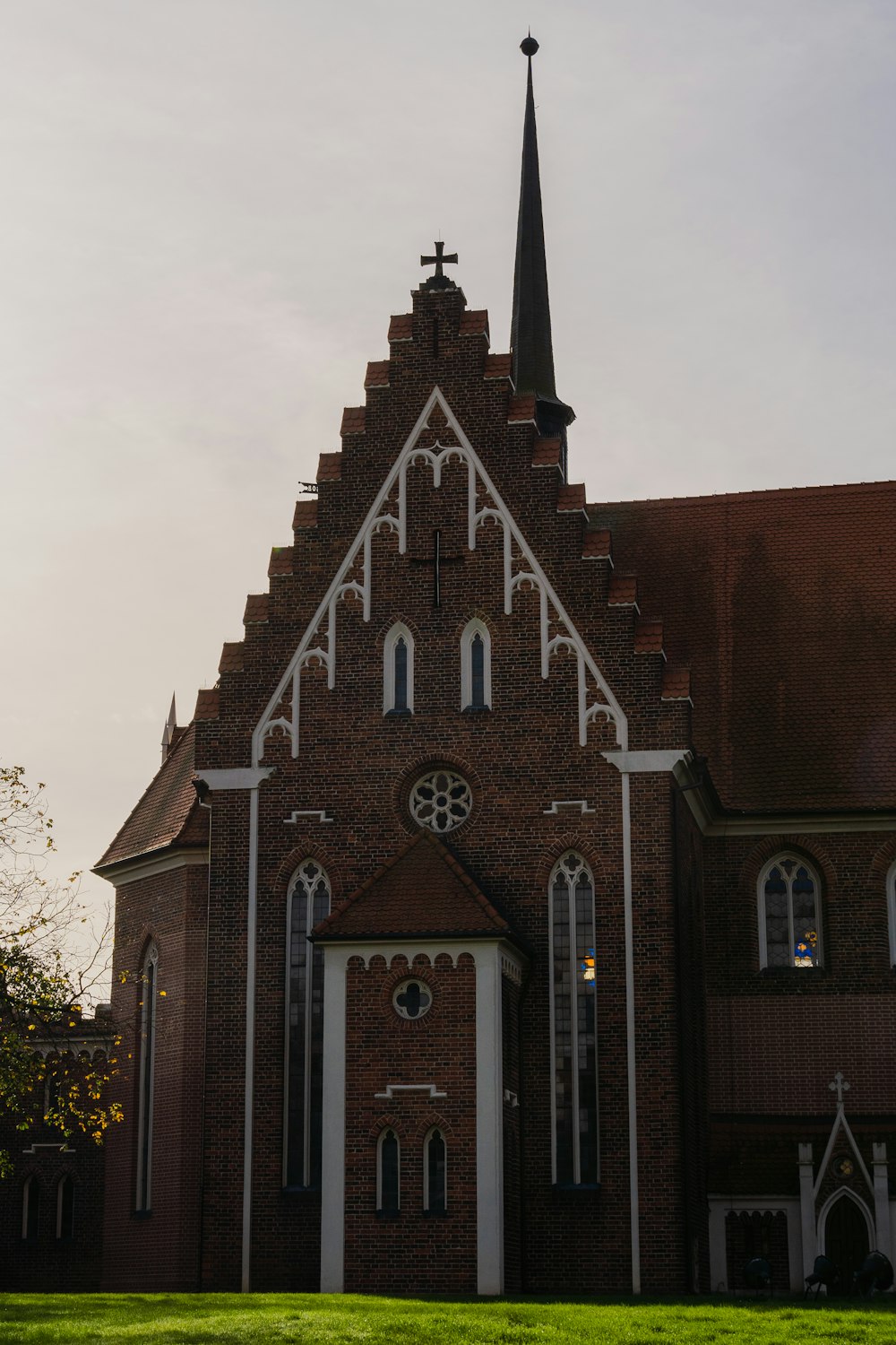 a brick church with a tall steeple