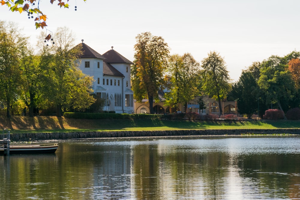 a house on a hill by a lake