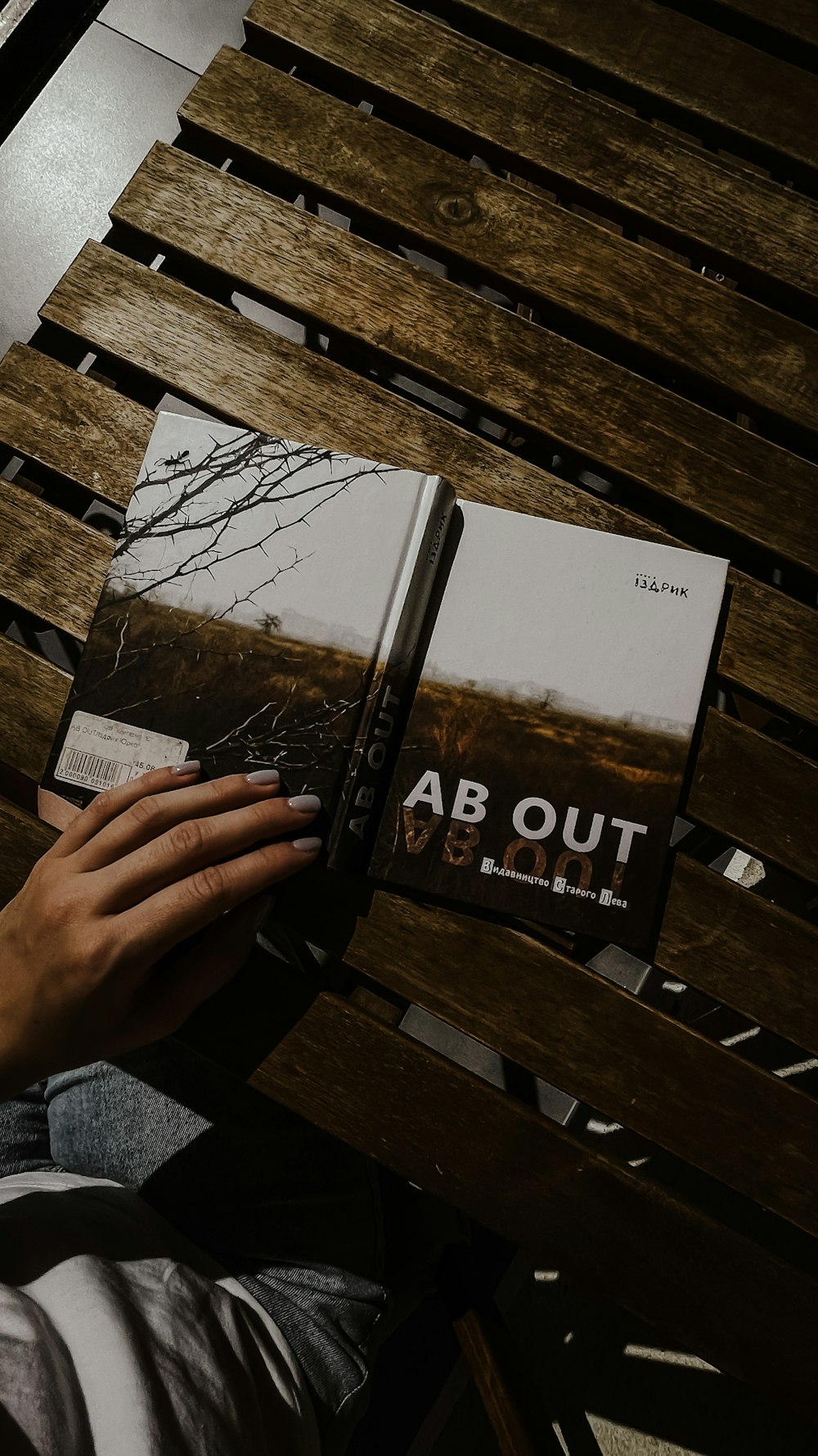 a hand holding a book