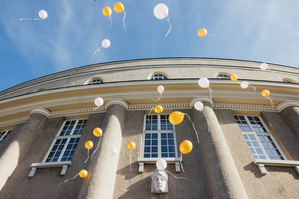 a building with balloons in the air