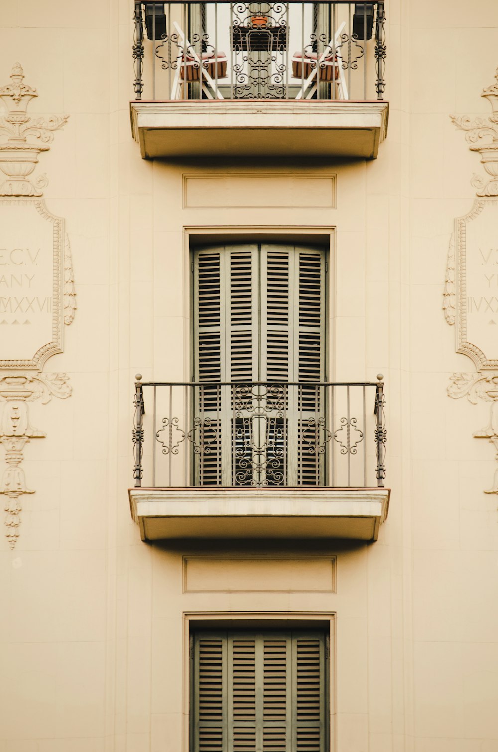 a window with a railing and a balcony with a railing