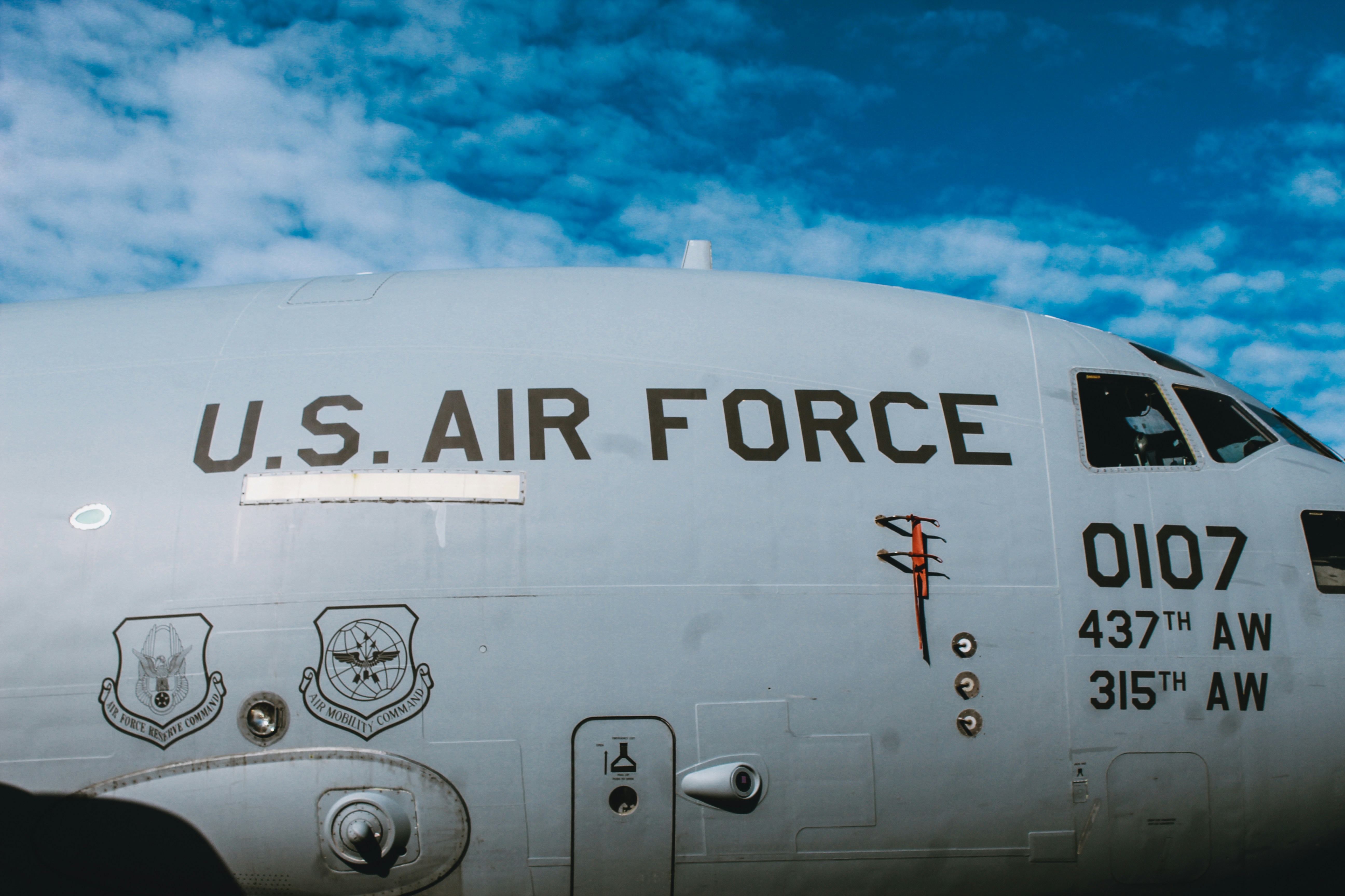 a white airplane with black text