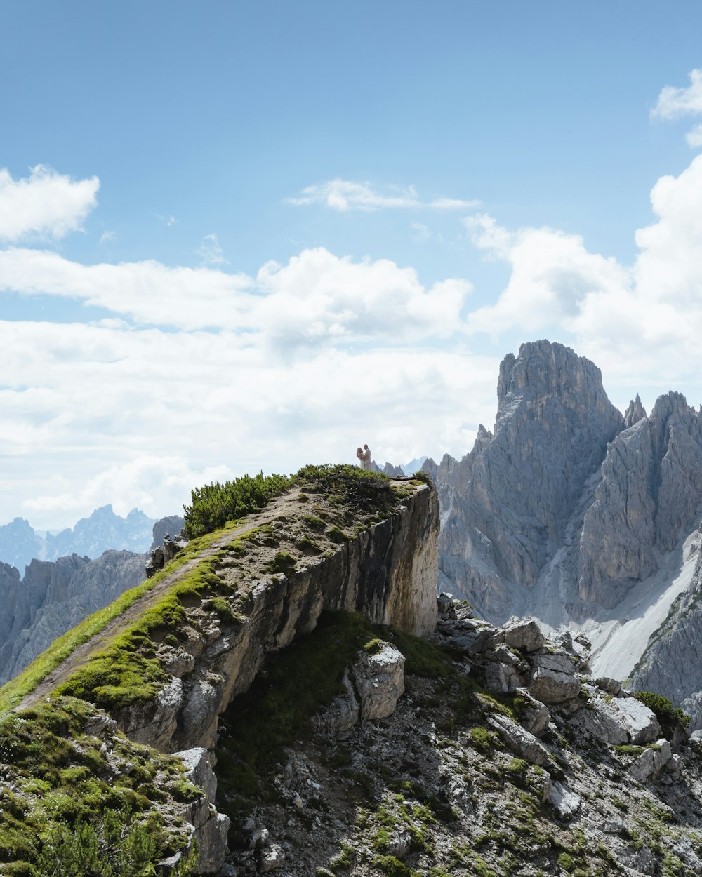 a person standing on a rocky hill