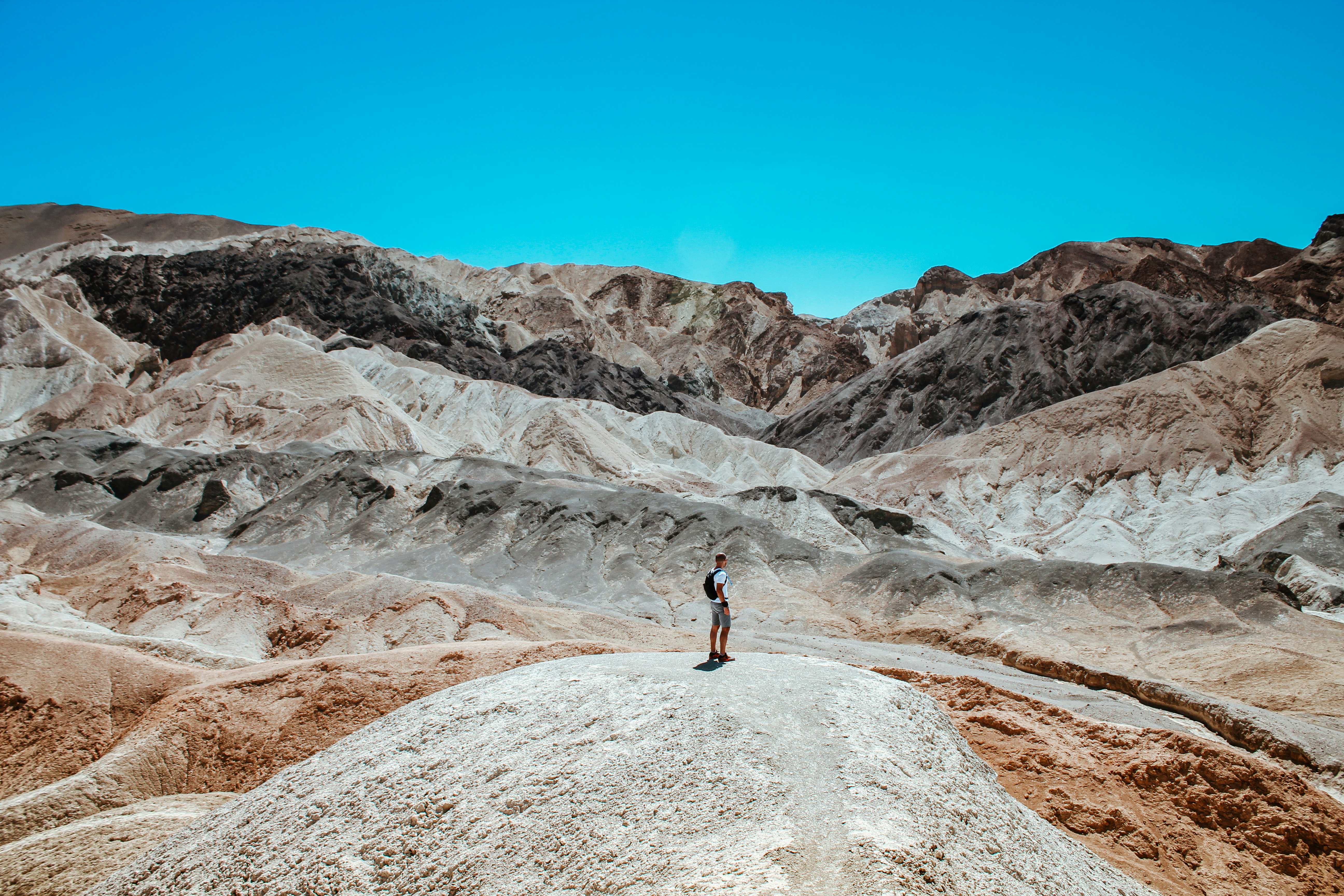 a person standing on a rocky hill
