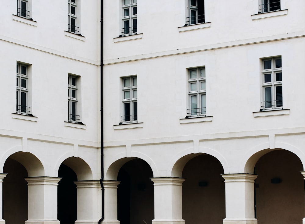 a white building with arched windows