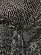 Ribbed fabric texture displayed under bright light