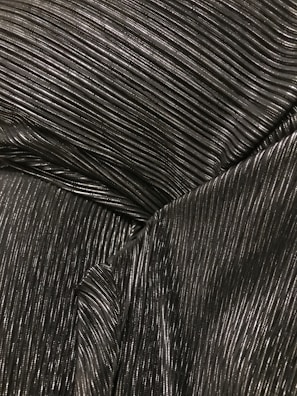 A close-up of a Rupali saree, reflecting its silver beauty.