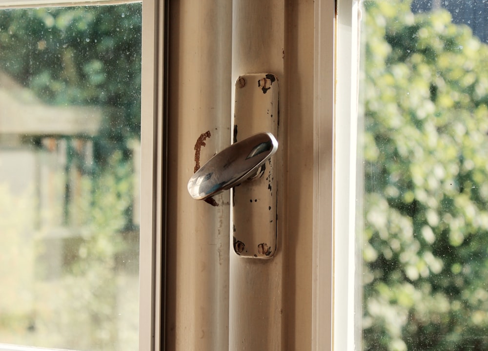 a door handle with a butterfly on it