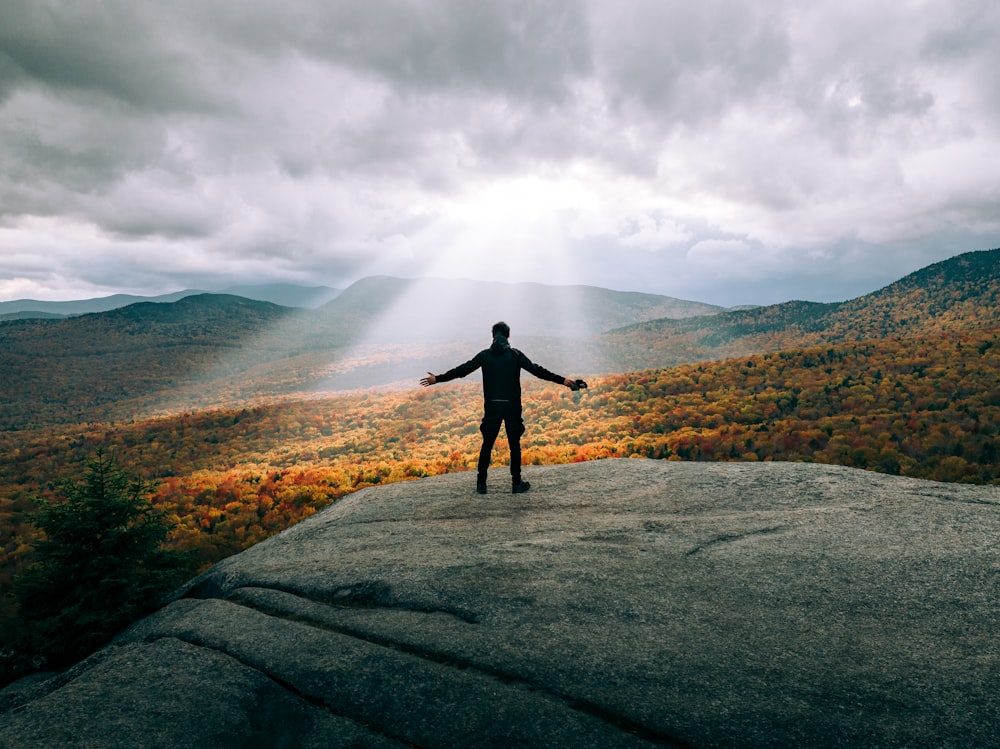 a person standing on a hill