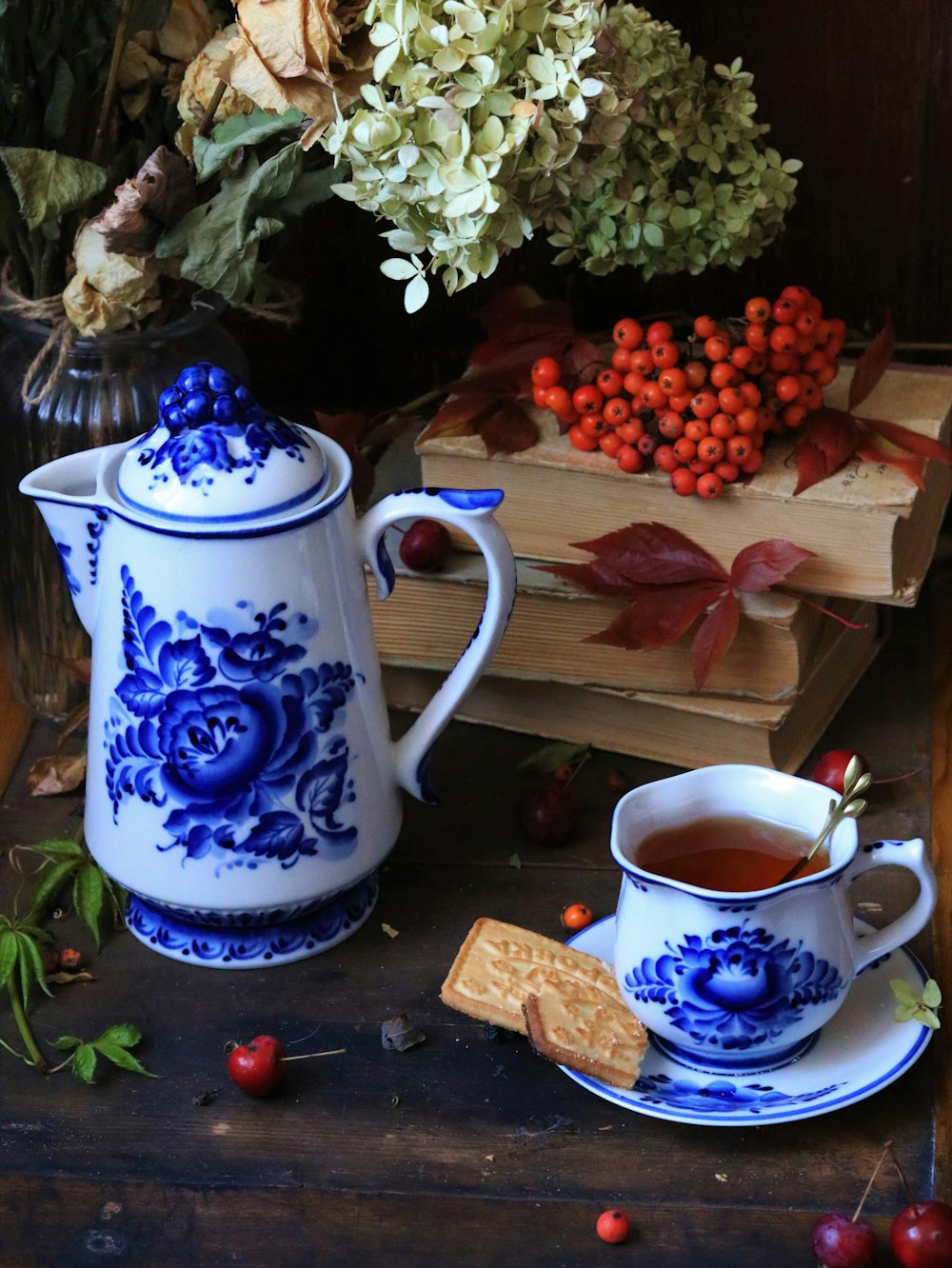 a table with a teapot and a cup of tea