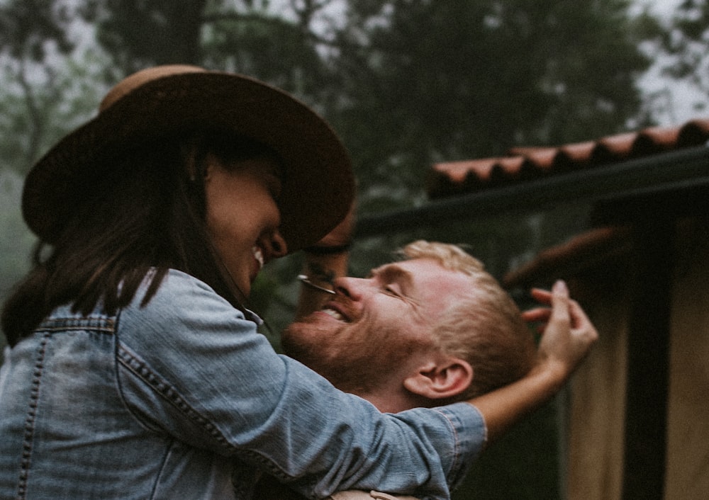 a woman kissing a man