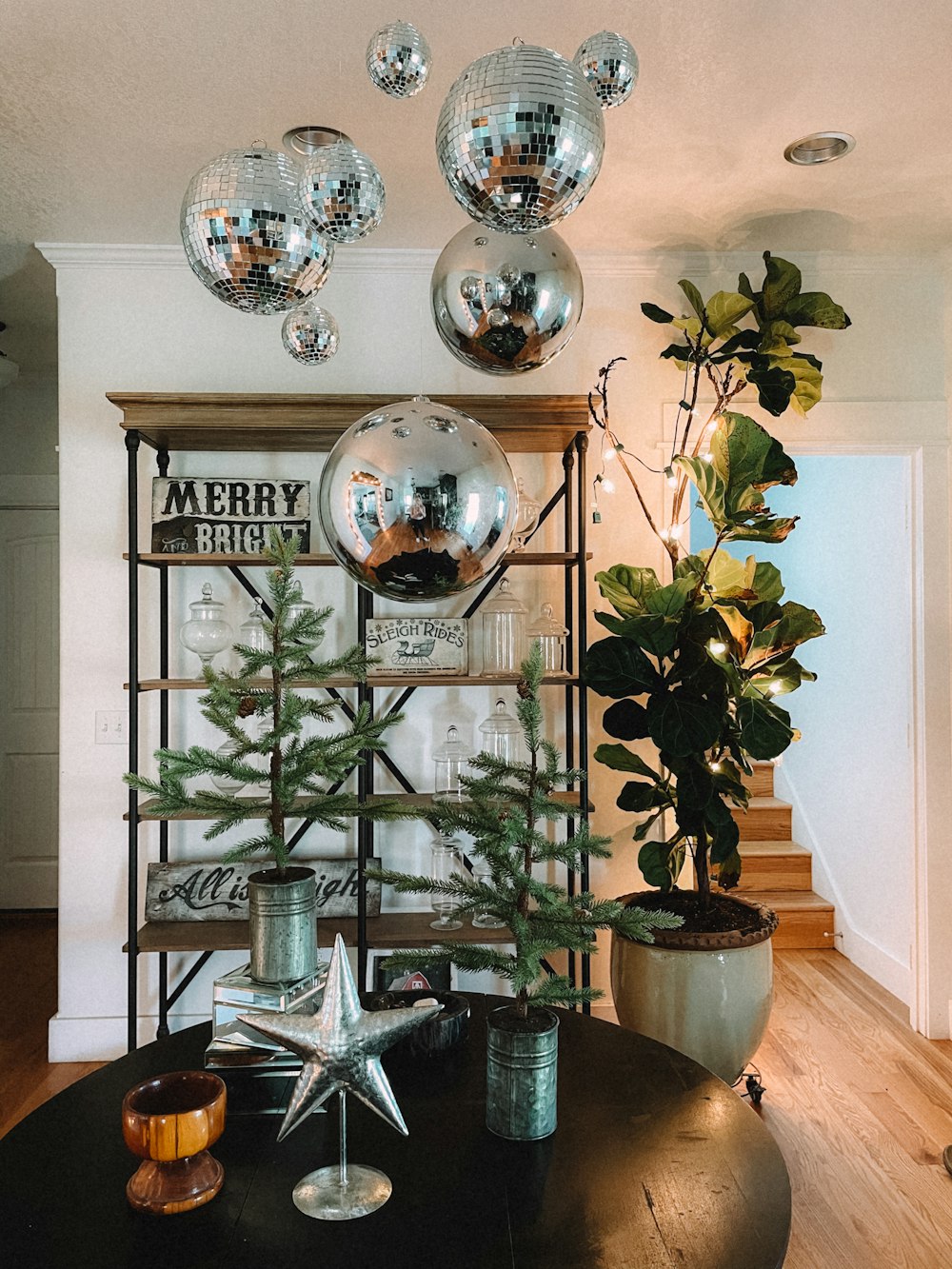 a table with a vase and plants