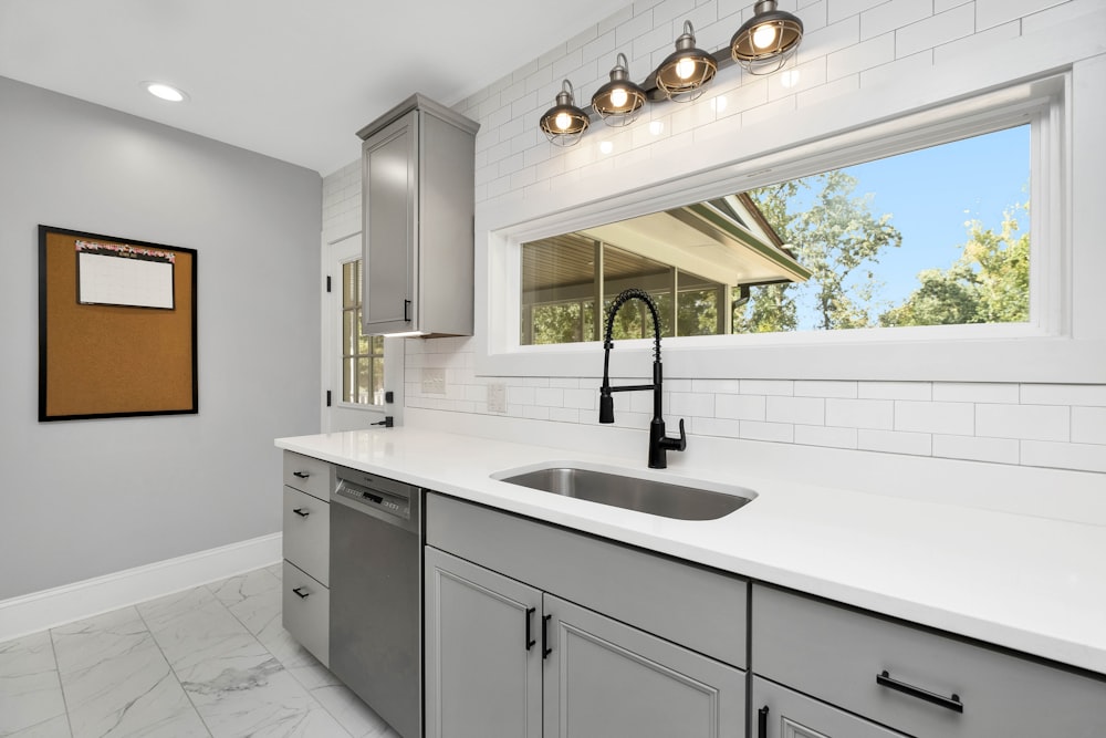 a kitchen with white cabinets