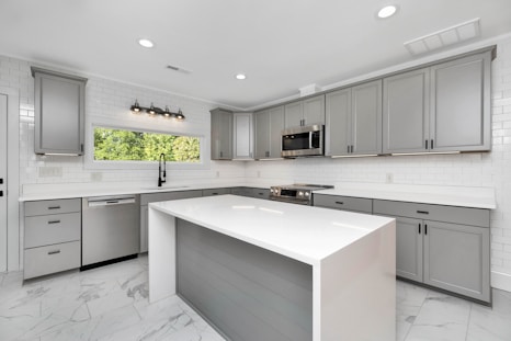a kitchen with white cabinets