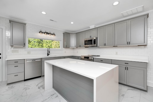 a kitchen with white cabinets