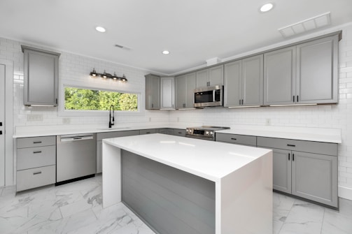 a kitchen with white cabinets