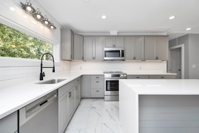 A fully equipped kitchen with sleek appliances and clean countertops.