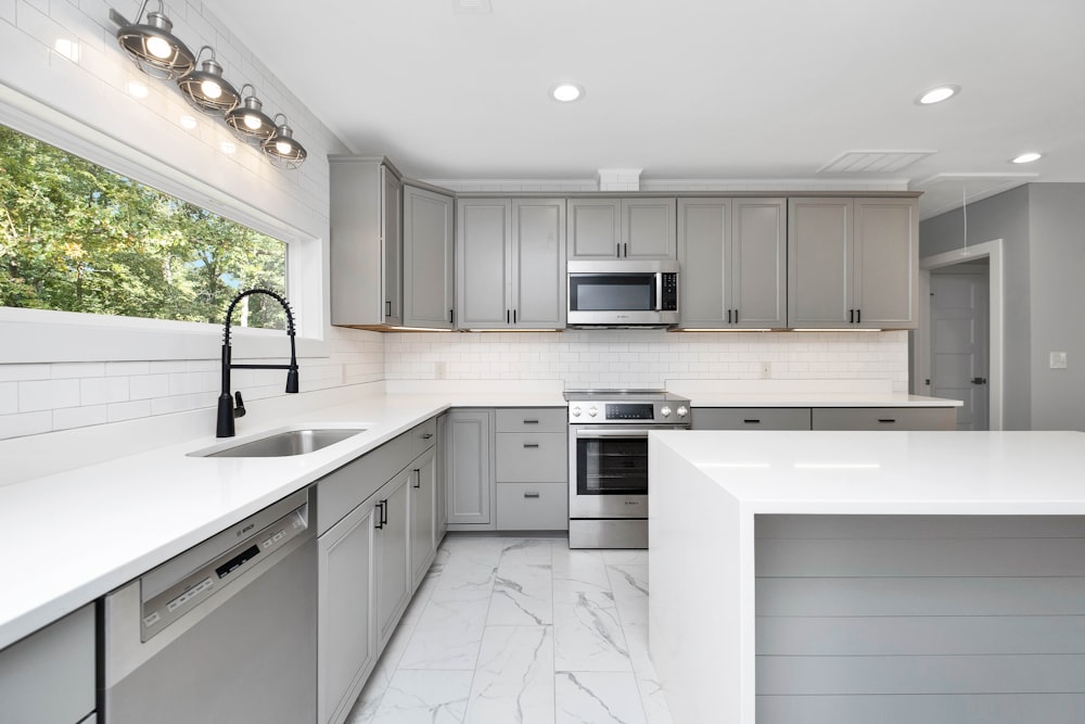 a kitchen with white cabinets