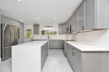 a kitchen with white cabinets