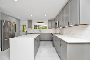 a kitchen with white cabinets