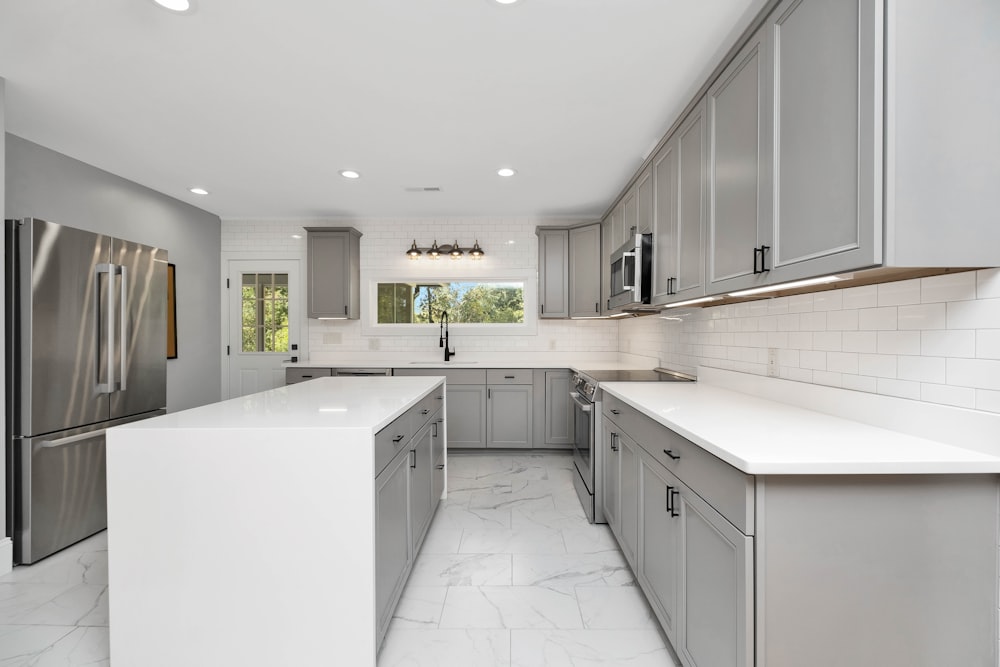 a kitchen with white cabinets