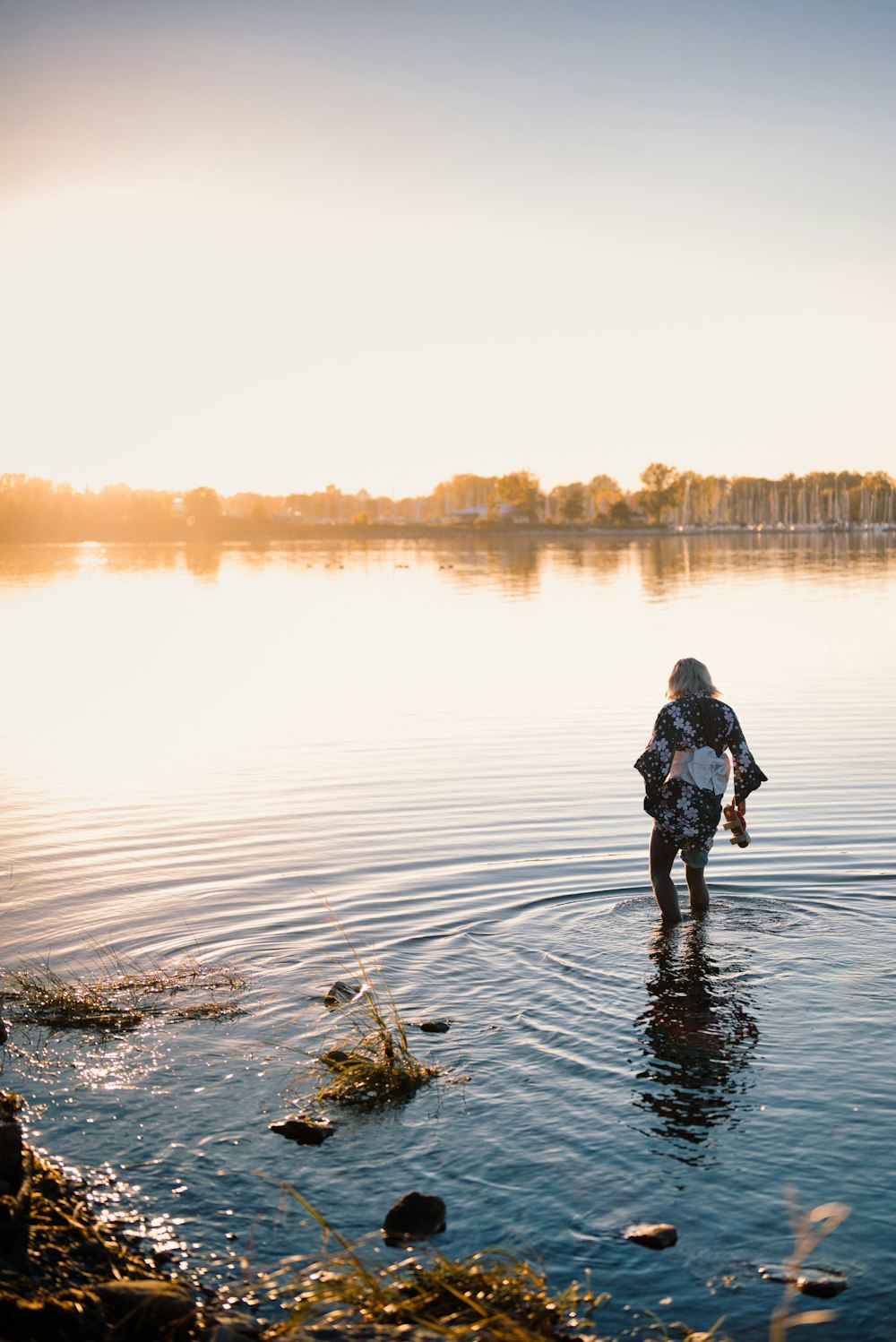 a man walking in a body of water