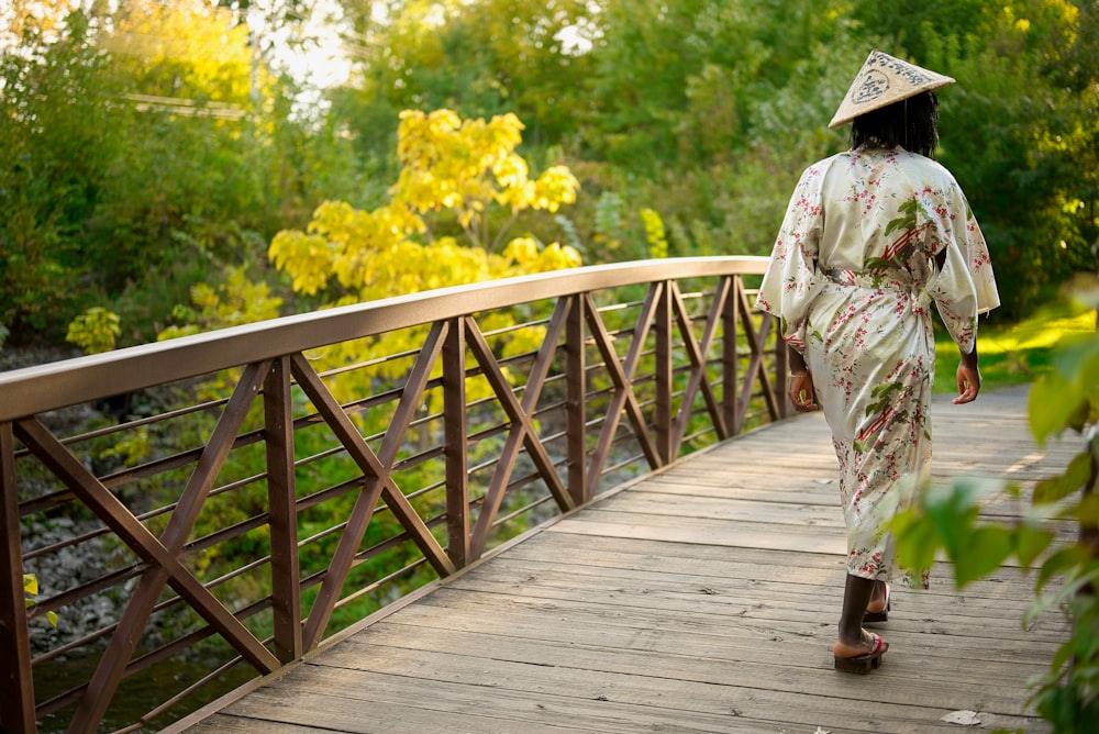 a person walking on a wooden bridge