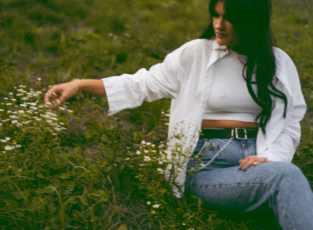 a person kneeling in a field