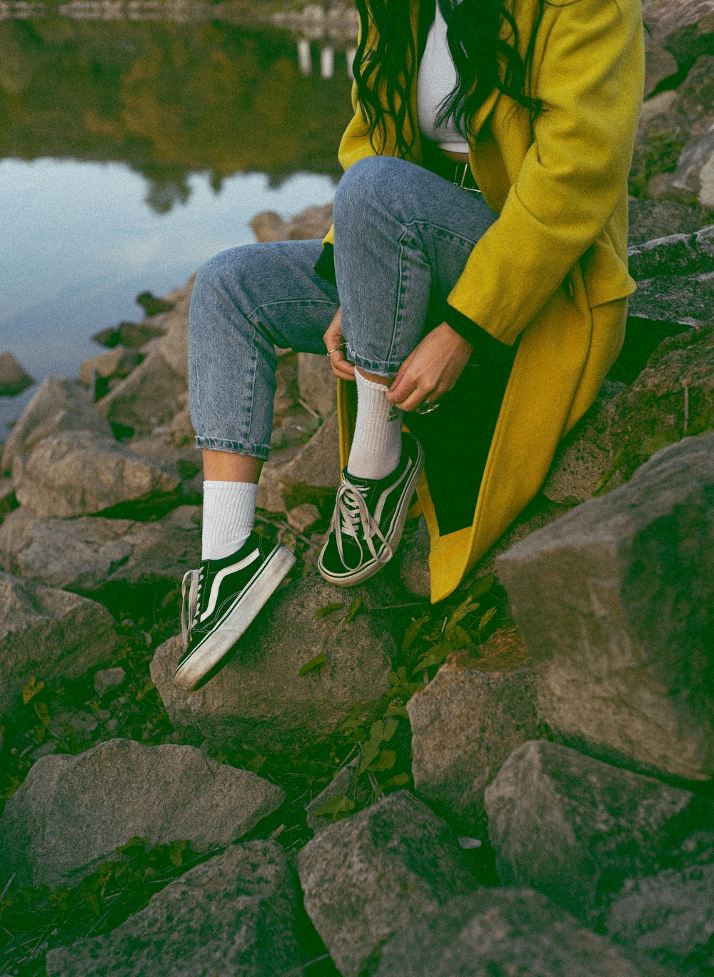 a man sitting on a rock