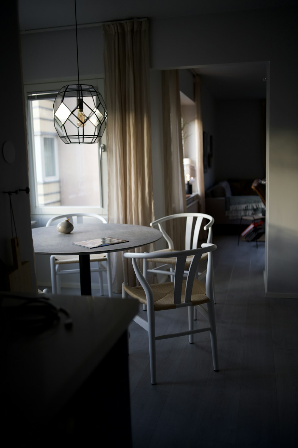 a dining room with a table and chairs